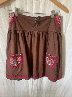 Brown Mini Skirt with Pink Floral Patch Pocket Details, Red Trim, and Zipper